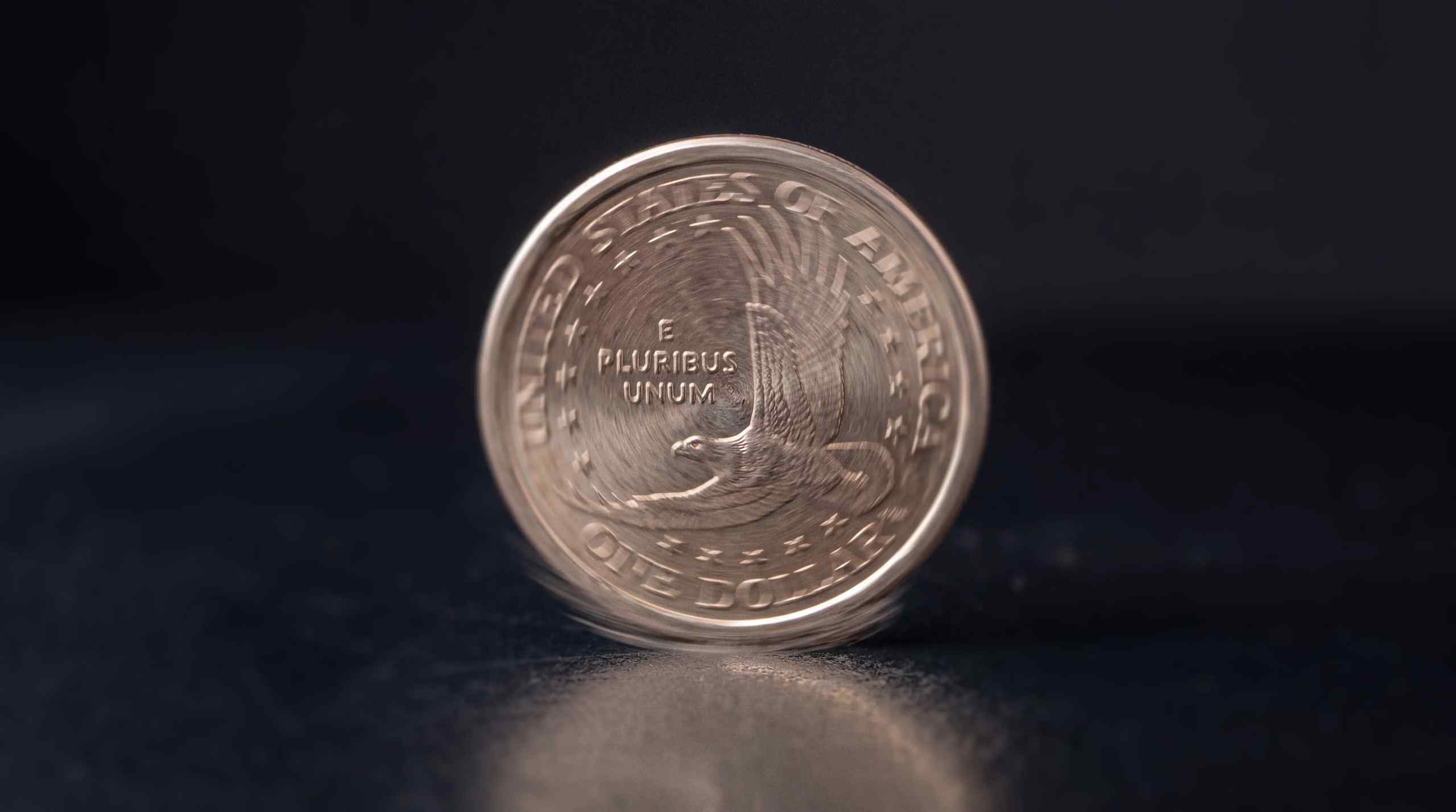 A coin on its side representing a 50% coin flip situation.